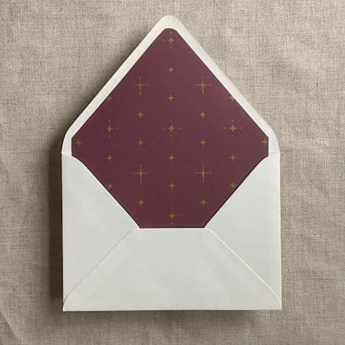 This is a red wedding envelopes by Ivory Invitations called gold stars burgundy envelope liner for a7 euro flap envelope | pack of 10 in standard