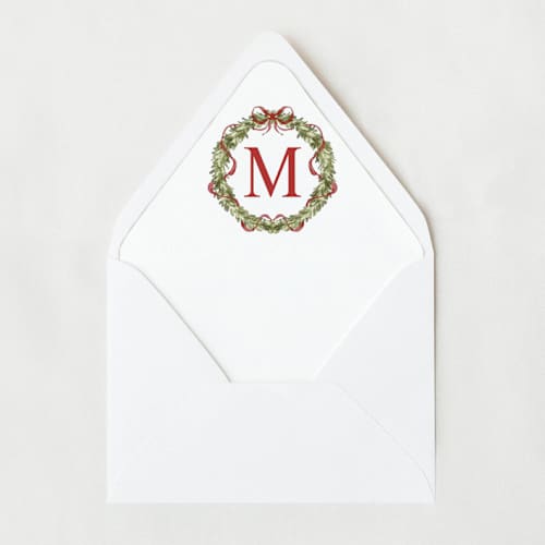 This is a red wedding envelopes by Nikki Turner called christmas wreath monogram | set of 25 envelope liners in standard