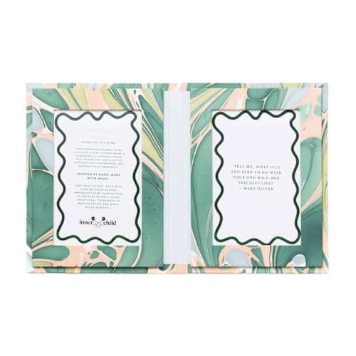 This is a green accent pieces by Inner Child called hand marbled picture frame folding book, 4x6 in green and pink in standard