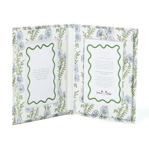 This is a blue accent pieces by Inner Child called blockprint picture frame folding book, 4x6 in forget-me-not in standard