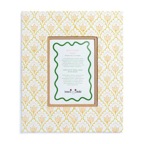This is a beige accent pieces by Inner Child called large wall picture frame in desert sand tulip, 5x7 in standard