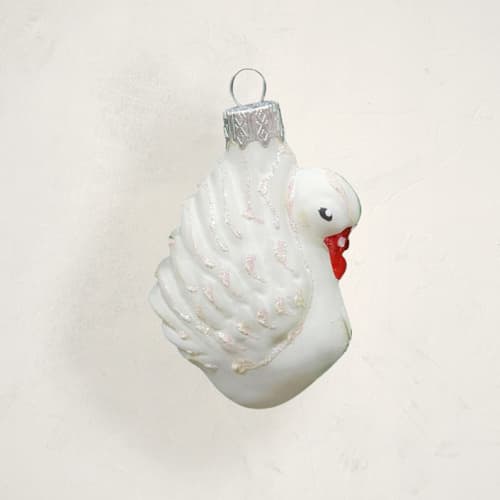This is a cream christmas ornaments by Minted called white swan glass ornament by glass by iness in standard