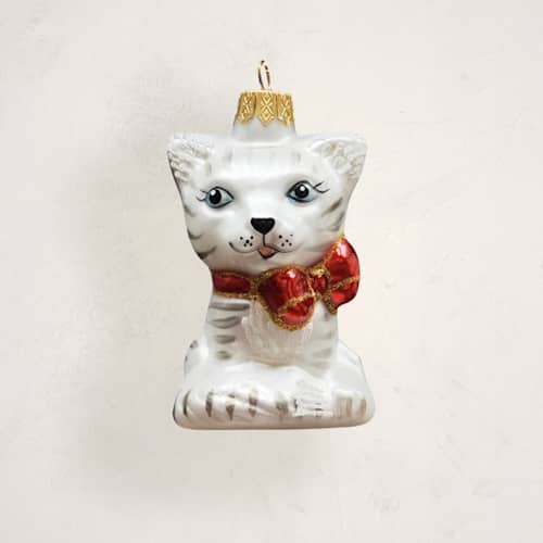 This is a snow christmas ornaments by Minted called cat with bow glass ornament by glass by iness in standard