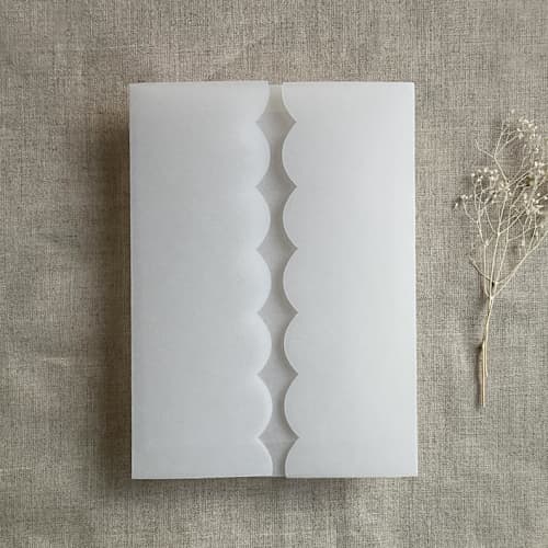 This is a white vellum wedding invitations by Ivory Invitations called emberlin scallop edge plain vellum wrap for 5x7 card | pack of 10 in standard