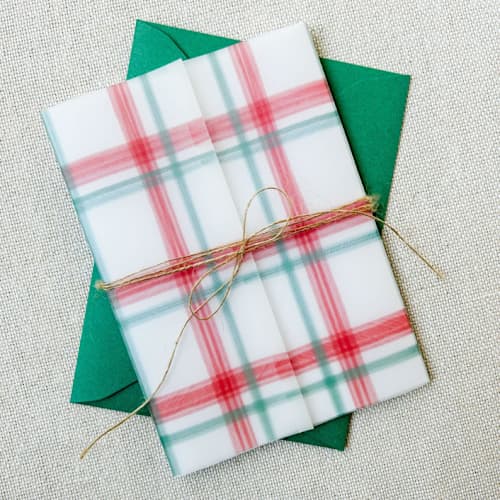 This is a red vellum wedding invitations by Megan Tendler called christmas plaid vellum jackets | set of 10 in standard