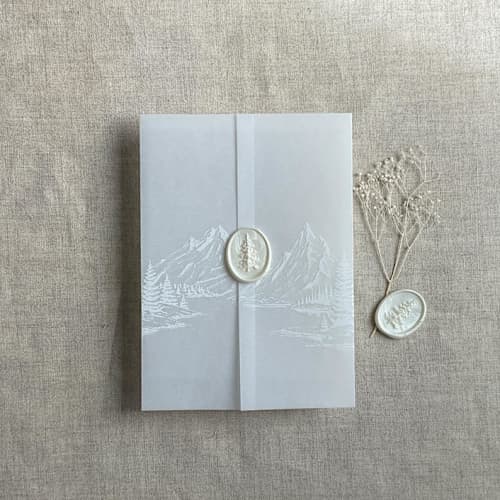 This is a white vellum wedding invitations by Ivory Invitations called white ink mountain sketch printed vellum wrap for 5x7 card | pack of 10 in standard