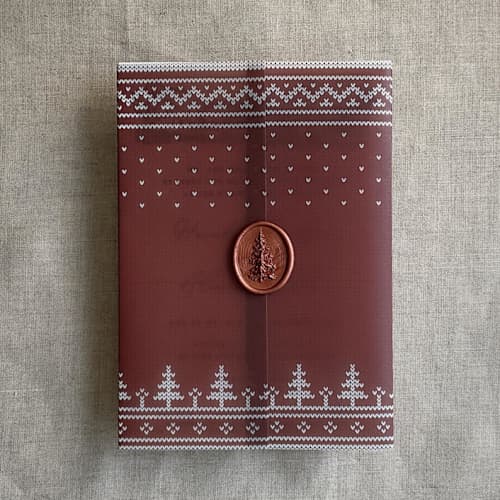 This is a red vellum wedding invitations by Ivory Invitations called burgundy knitted holiday vellum wrap for 5x7 card | pack of 10 in standard