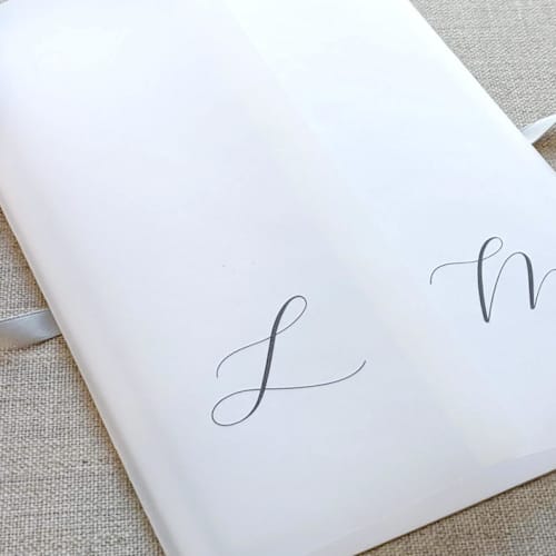 This is a black vellum wedding invitations by Caroline Russo called personalized vellum jacket with initials (set of 10) in standard