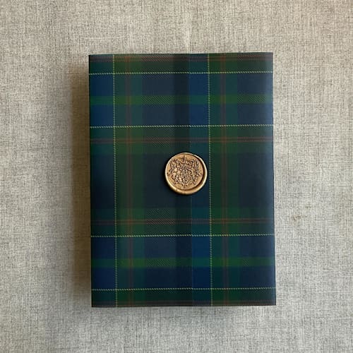 This is a green vellum wedding invitations by Ivory Invitations called plaid lovers green blue tartan printed vellum wrap for 5x7 card | pack of 10 in standard
