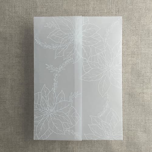 This is a white vellum wedding invitations by Ivory Invitations called white poinsettia vellum wrap for 5x7 card | pack of 10 in standard
