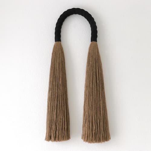 This is a black sculpture art by Bharti Trivedi called black jute arch in standard