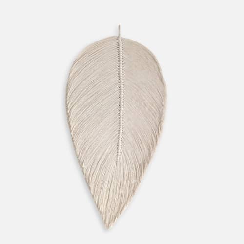 This is a natural sculpture art by Bharti Trivedi called macrame leaf in ivory in standard