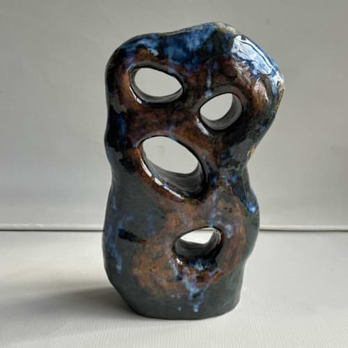 This is a multicolorassorted-colors sculpture art by Nina Leth called hole goal in standard