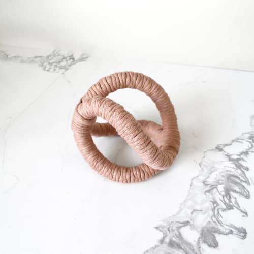 This is a orange sculpture art by Bharti Trivedi called infinity table sculpture - peach in standard