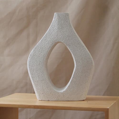 This is a white sculpture art by Virginia Felix called eden sculpture in standard