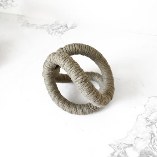 This is a green sculpture art by Bharti Trivedi called infinity sculpture in sage in standard
