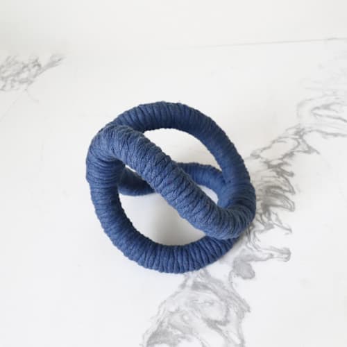 This is a blue sculpture art by Bharti Trivedi called infinity table sculpture- blue in standard