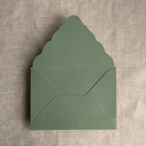 This is a green wedding envelopes by Ivory Invitations called mid green a7 venetian flap envelope | pack of 25 in standard