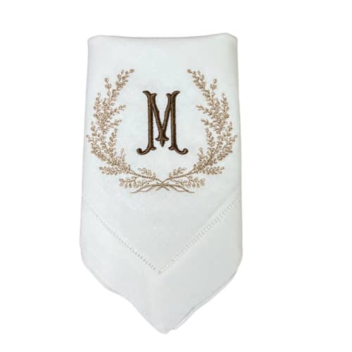 This is a white tableware by Virginia Marcello called custom monogram embroidered napkins in standard