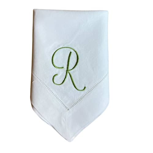This is a white tableware by Virginia Marcello called embroidered dinner napkins with single monogram script font- set of 4 in standard