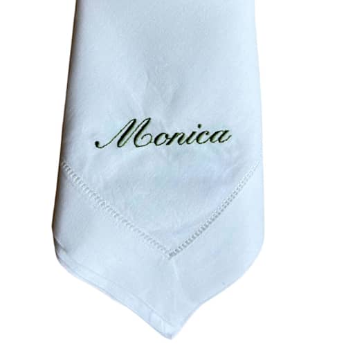 This is a black tableware by Virginia Marcello called custom name-embroidered dinner napkins in standard