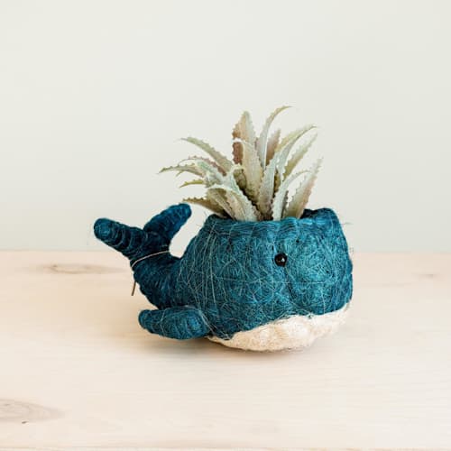 This is a blue accent pieces by LIKHA called whale planter in standard