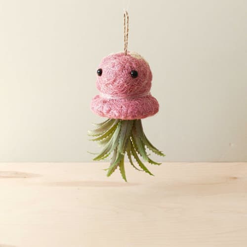 This is a pink accent pieces by LIKHA called octopus planter in standard