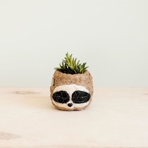 This is a brown accent pieces by LIKHA called mini pot 3-tone (dark) sloth planter in standard