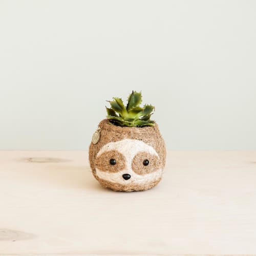 This is a brown accent pieces by LIKHA called mini pot 2-tone (light) sloth planter in standard