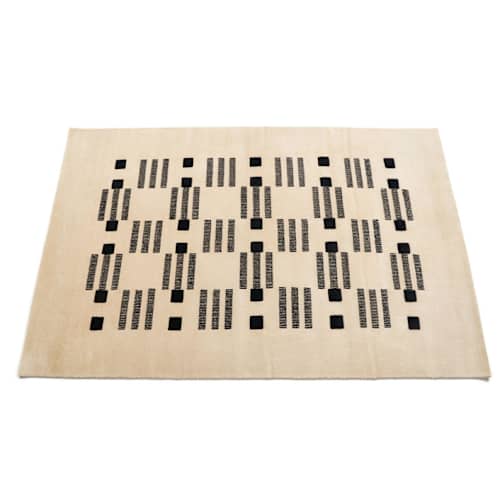 This is a white rugs by Anjali Purohit called varj hand knotted rug in standard
