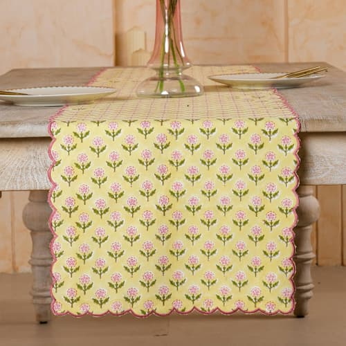This is a yellow tableware by Inner Child called mona scallop embroidered blockprint tablerunner in butter yellow in standard