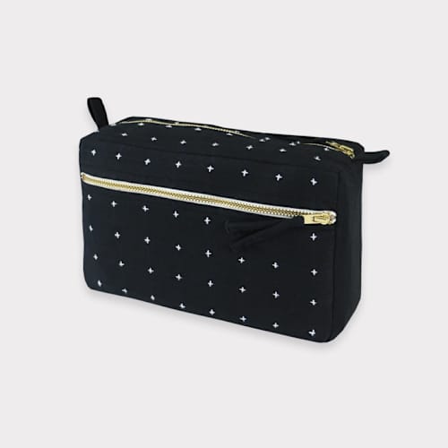 This is a black back to school supplies by Anchal called medium cross-stitch toiletry bag - charcoal in standard