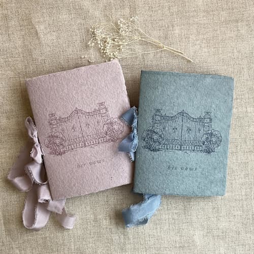 This is a blue vow books by Ivory Invitations called villa wedding vow books thistle and denim blue | set of 2 books | includes 1 her vows and 1 his vows in standard