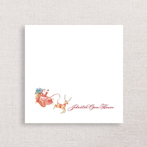 This is a white decorative paper napkins by Papel Custom Design called santa and reindeer open house premium napkins in standard