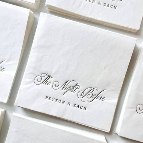 This is a white decorative paper napkins by Alyssa Cook called the night before cocktail napkins | custom rehearsal dinner decor | set of 50 in standard