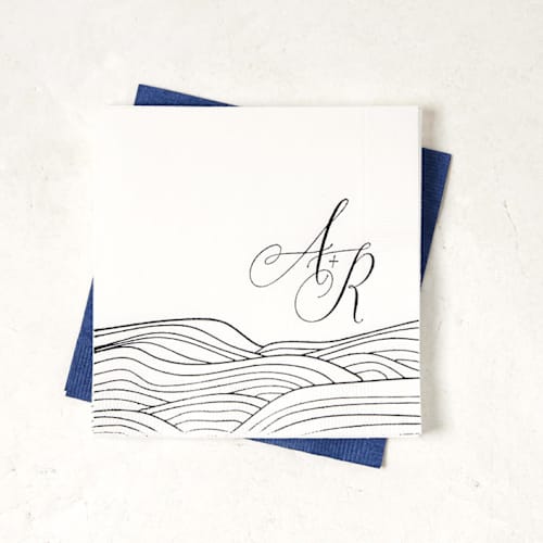 This is a white decorative paper napkins by ForYourParty called romantic waves with initials napkin, cocktail size, set of 100 in standard
