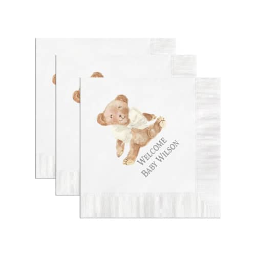 This is a white decorative paper napkins by Papel Custom Design called teddy bear with ivory bow personalized gender neutral baby shower napkin in standard