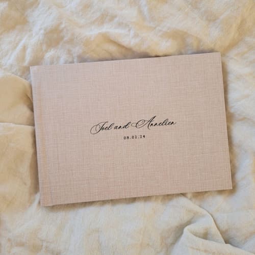 This is a multicolorassorted-colors guest books by Studio Lavender called photo guest book album in standard