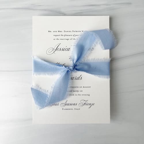 This is a blue wedding ribbon by Honey Silks Co called 1" x 5 yards cotton ribbon - kentucky blue in standard