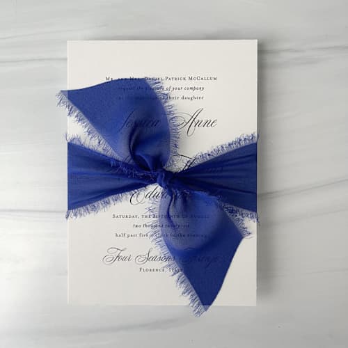 This is a blue wedding ribbon by Honey Silks Co called 2" signature sheer - lapis in standard