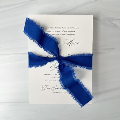 This is a blue wedding ribbon by Honey Silks Co called 1" cotton ribbon - royal blue in standard