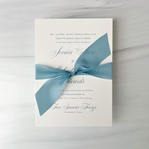 This is a blue wedding ribbon by Honey Silks Co called signature sheer invitation ribbon - dusted blue in standard