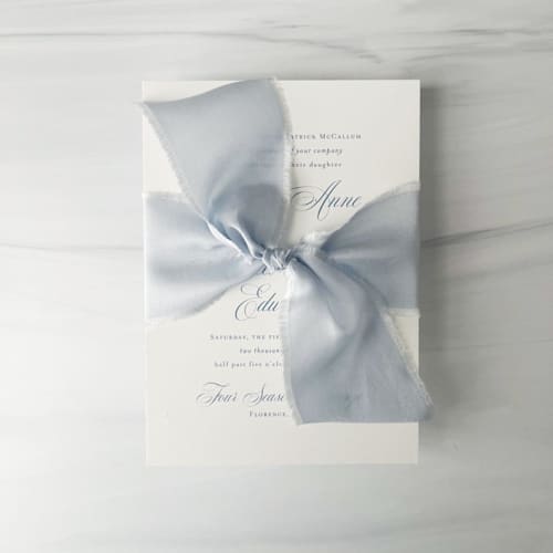 This is a blue wedding ribbon by Honey Silks Co called heirloom collection silk ribbon - pale dusty blue 2" in standard