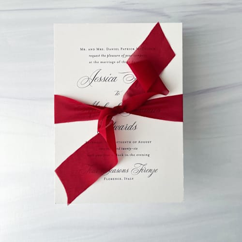 This is a red wedding ribbon by Honey Silks Co called 1" x 5 yards signature sheer - red in standard