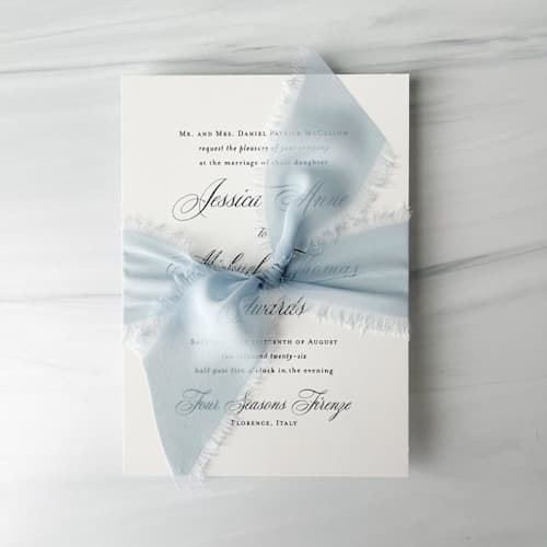 This is a blue wedding ribbon by Honey Silks Co called 2" signature sheer - baby blue in standard