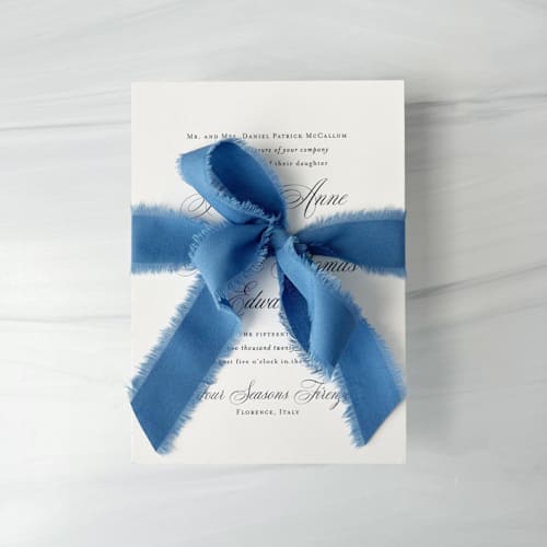 This is a blue wedding ribbon by Honey Silks Co called 1" cotton ribbon - deep carolina blue in standard