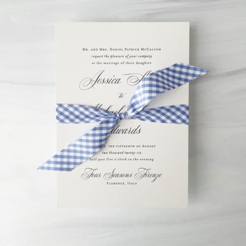 This is a blue wedding ribbon by Honey Silks Co called 3/4" cotton ribbon - blue gingham in standard