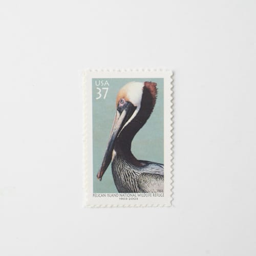 This is a blue stamps by Flourish Fine Writing called 37 cent pelican postage stamps // set of 10 // unused vintage stamps in standard
