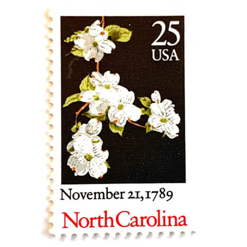 This is a black stamps by Heritage Post House called north carolina bicentenary statehood postage stamps | statehood issue | flowering dogwood | wedding stamps | vintage unused usps postage 25c | pack of 10 in standard