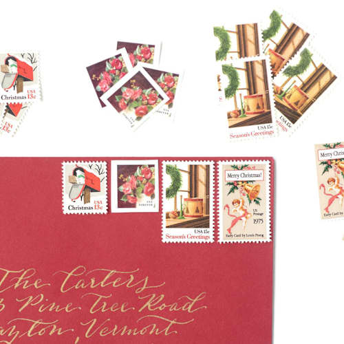 This is a red stamps by Flourish Fine Writing called red vintage holiday postage set - 2 ounce postage value per envelope, wreath and toys in standard